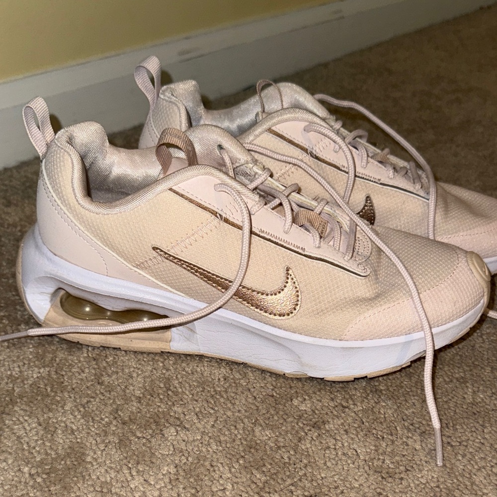 Nike light pink Sneakers with Bronze Swoosh